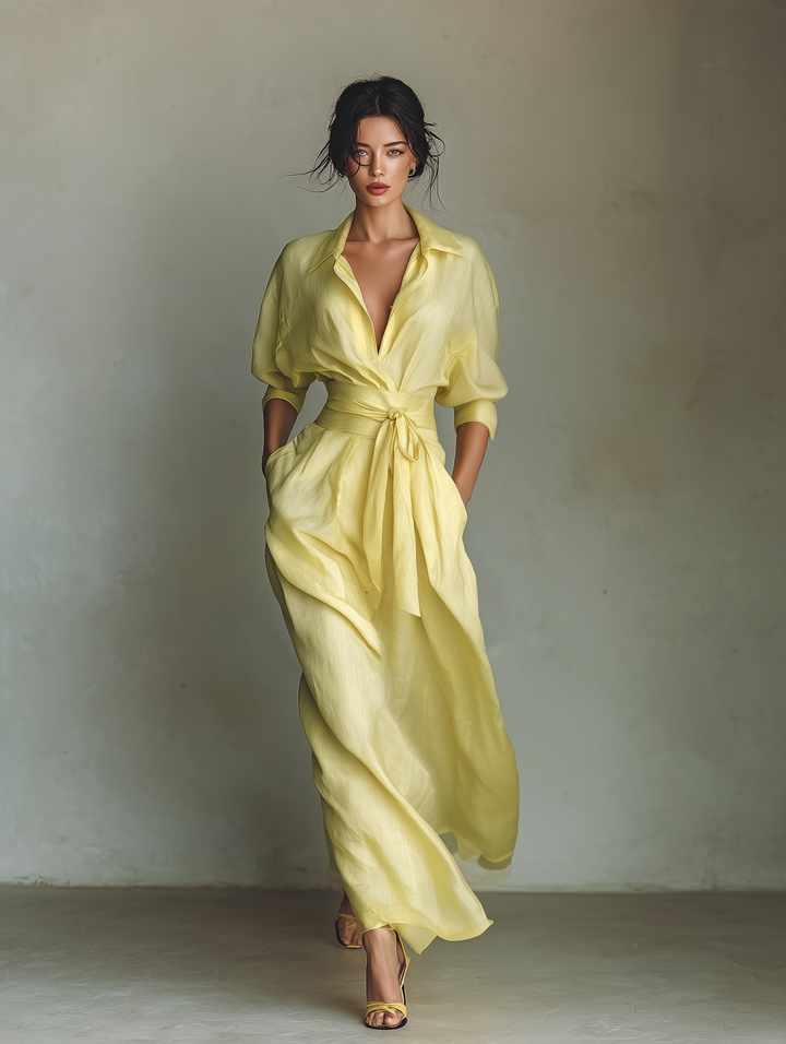 Vibrant yellow maxi shirt dress for women, featuring a flattering tie belt and three-quarter sleeves. Ideal for summer.