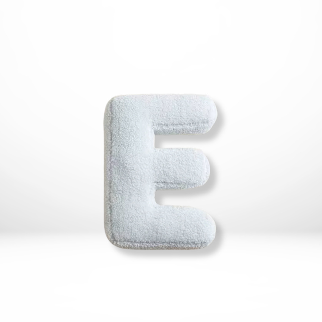 Vibrant velvet 'I' alphabet cushion, a soft decorative pillow for contemporary home living rooms.