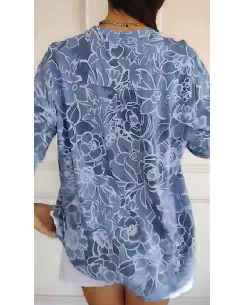 Front view of a women's elegant floral print blouse with a comfortable relaxed fit, spring style.