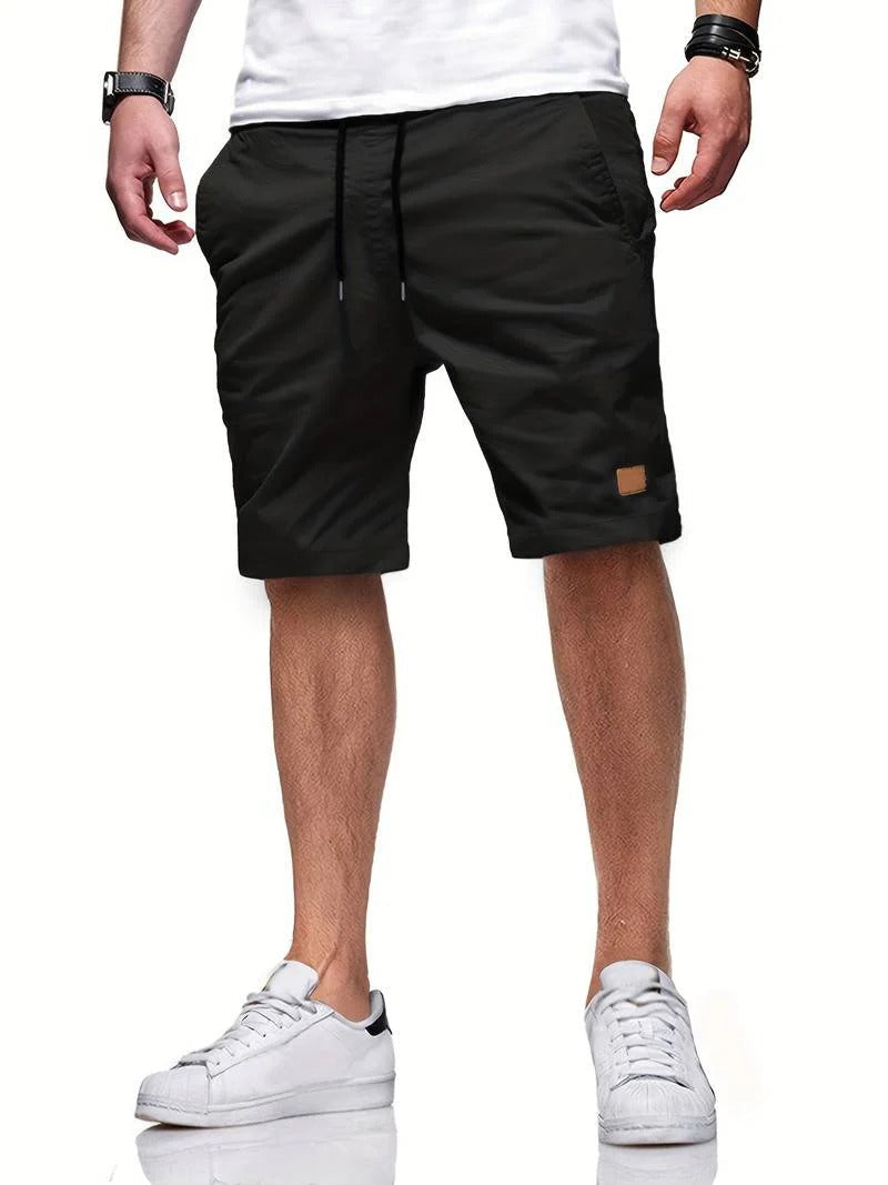 Relaxed fit men's shorts with drawstring, versatile for everyday wear & ultimate comfort.