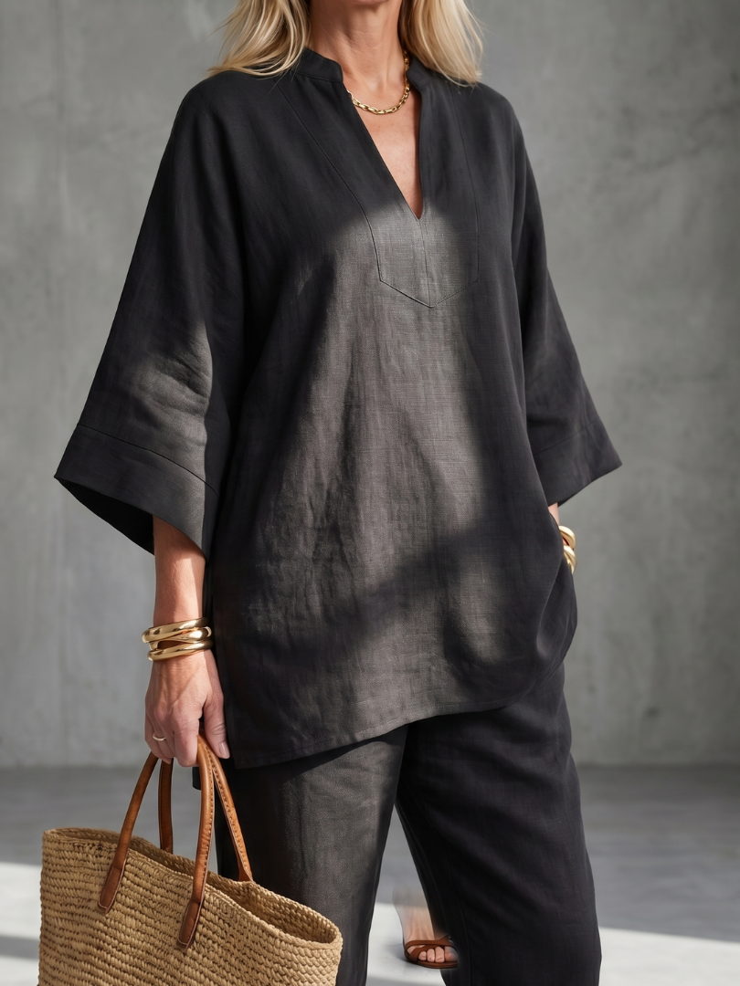 Women's casual two-piece set featuring a relaxed V-neck tunic & gathered trousers.