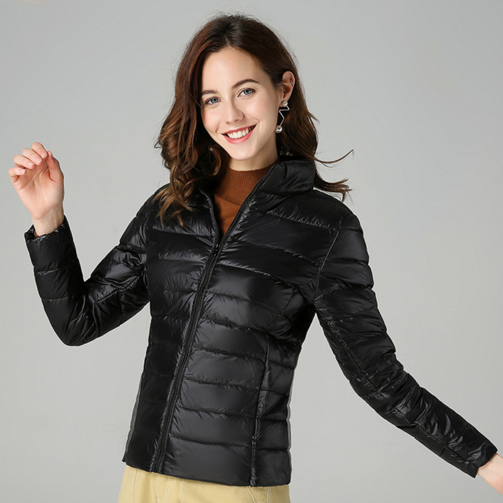 Ultralight women's waterproof rain jacket, offering superior protection for outdoor & casual all-weather use. Stylish.