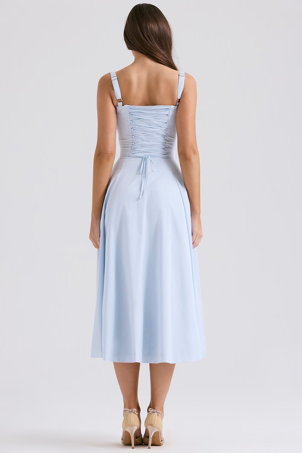 Back view of a women's elegant blue midi dress, showcasing the corset and lace-up design.