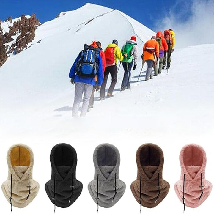 Hiker wearing a warm, windproof ArcticShield 3-in-1 winter hat for cold weather adventures & skiing.