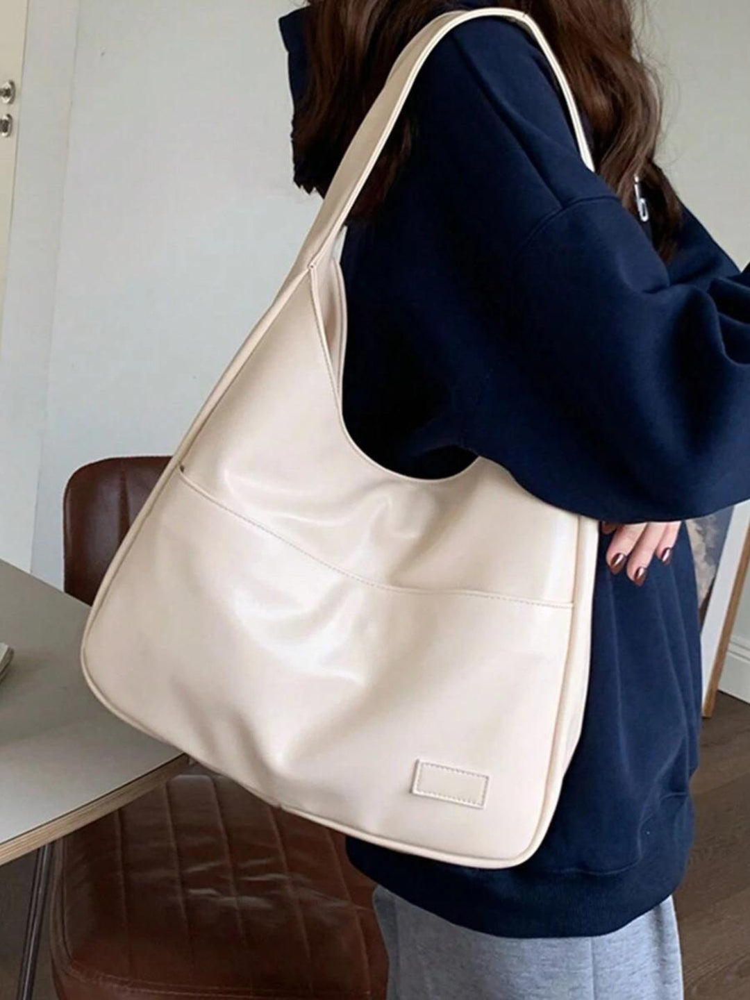Comfortable women's vegan leather everyday shoulder bag. Chic design for school, work, or a busy day out.