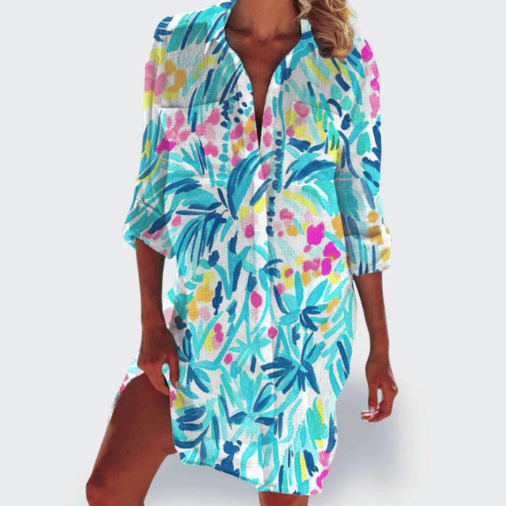 Women's lightweight summer dress, vibrant and flowy midi style for beach or casual wear.