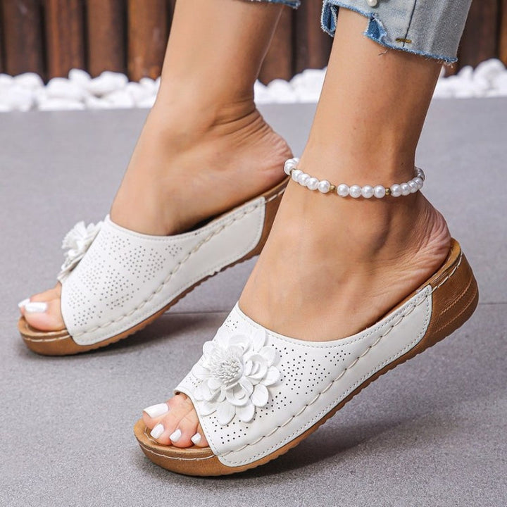 Stylish women's wedge sandals, perfect for casual summer outfits; features orthopedic comfort.