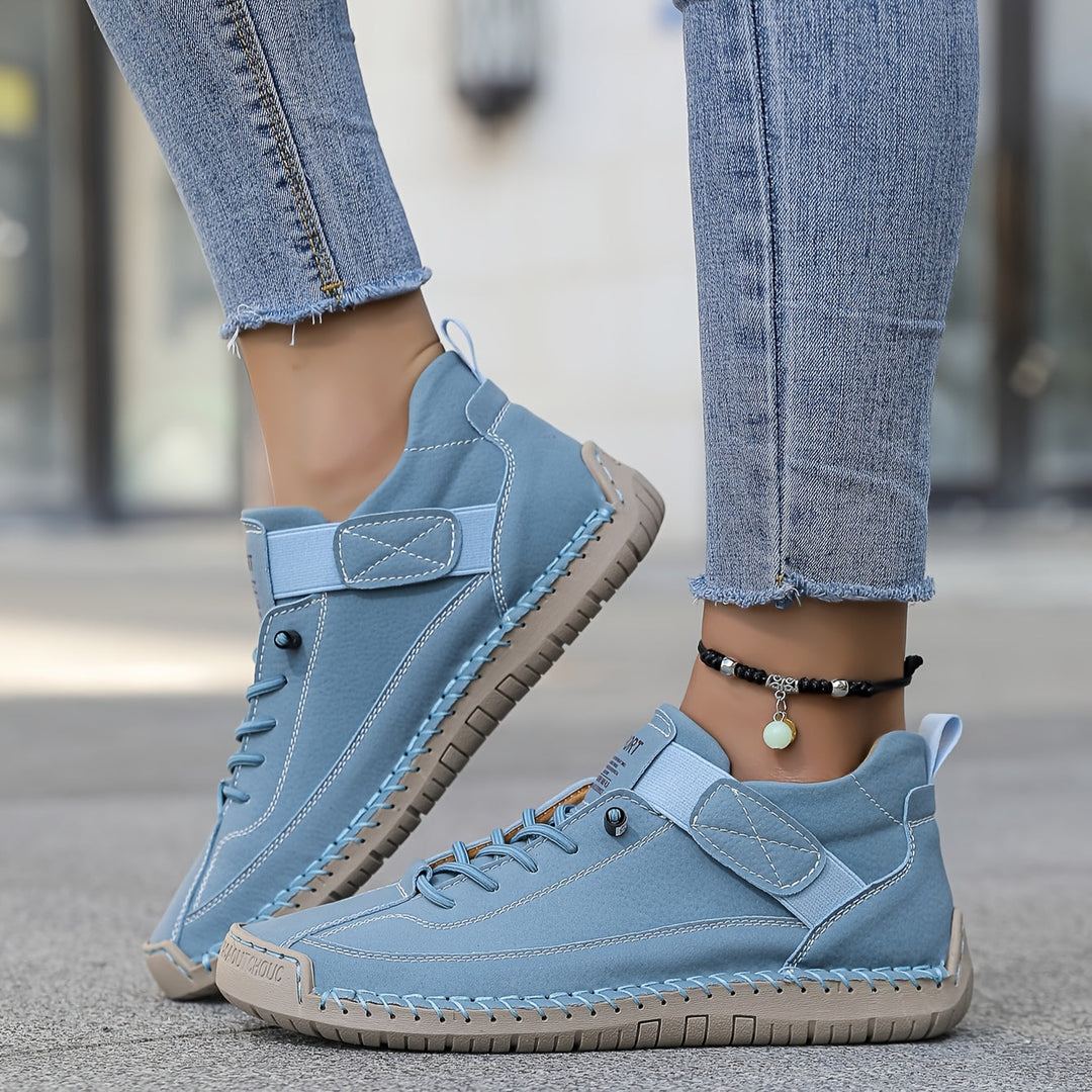 Women's comfort trainers with an adjustable strap, providing orthopaedic support & a cushioned sole for walking.
