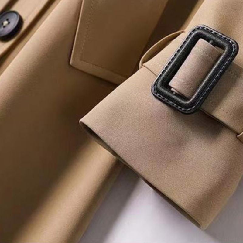 Fashionable women's belted trench coat, a versatile outerwear piece for any season.