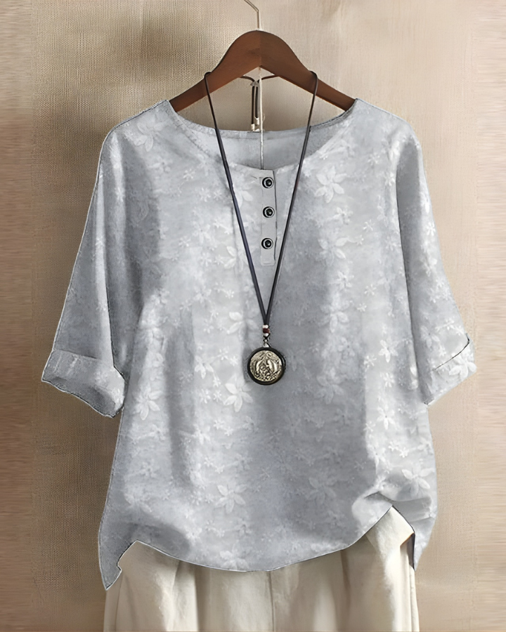 Boho chic women's top with a relaxed fit and colorful print, perfect for sunny days.
