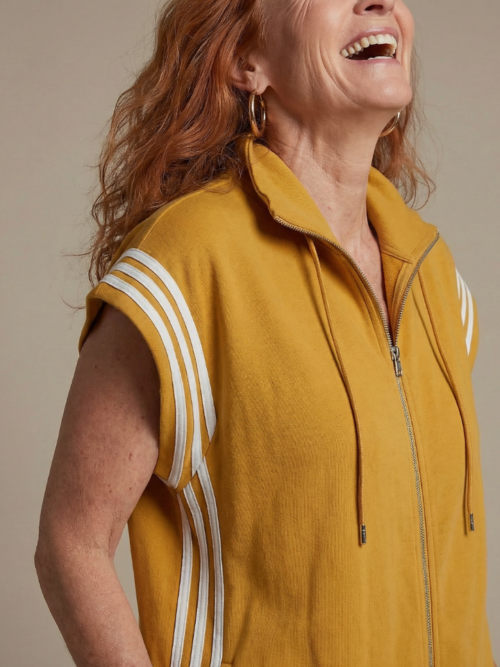 Women's full-length relaxed fit jumpsuit. Features a practical zip front & sophisticated stripe panels.