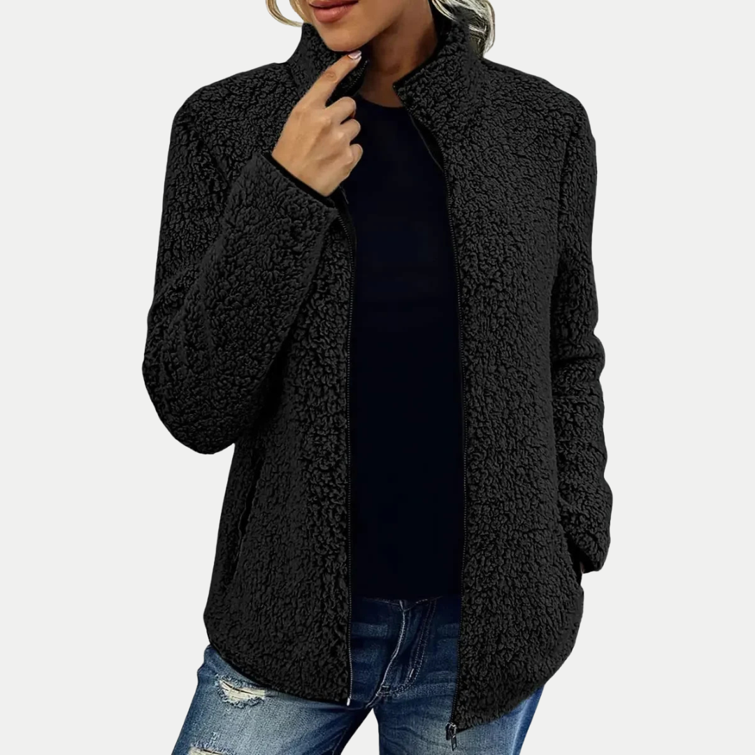 Casual women's textured zip-up fleece jacket with a high collar and long sleeves. Essential everyday versatile outerwear.