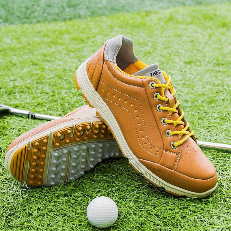 White women's golf shoes with spikes, engineered for comfort, waterproof performance & superior grip.