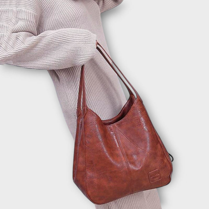 Classic women's vintage leather tote bag, perfect for everyday use, stylish & durable.