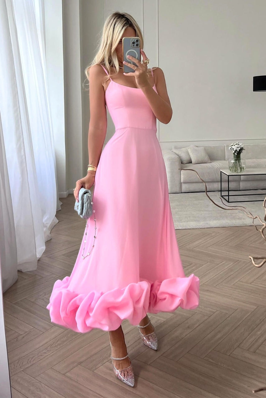 Elegant women's flowing midi dress, perfect for wedding guests & formal summer occasions. Chic and versatile party wear.