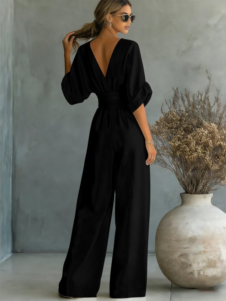 Modern V-neck women's jumpsuit, a versatile one-piece for professional and leisure wear.