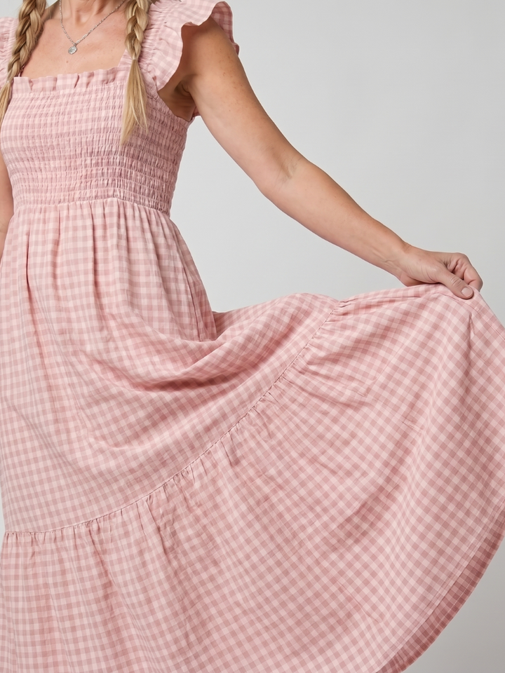 Women's sleeveless gingham midi dress with a square neck, ideal for elegant casual summer outfits.