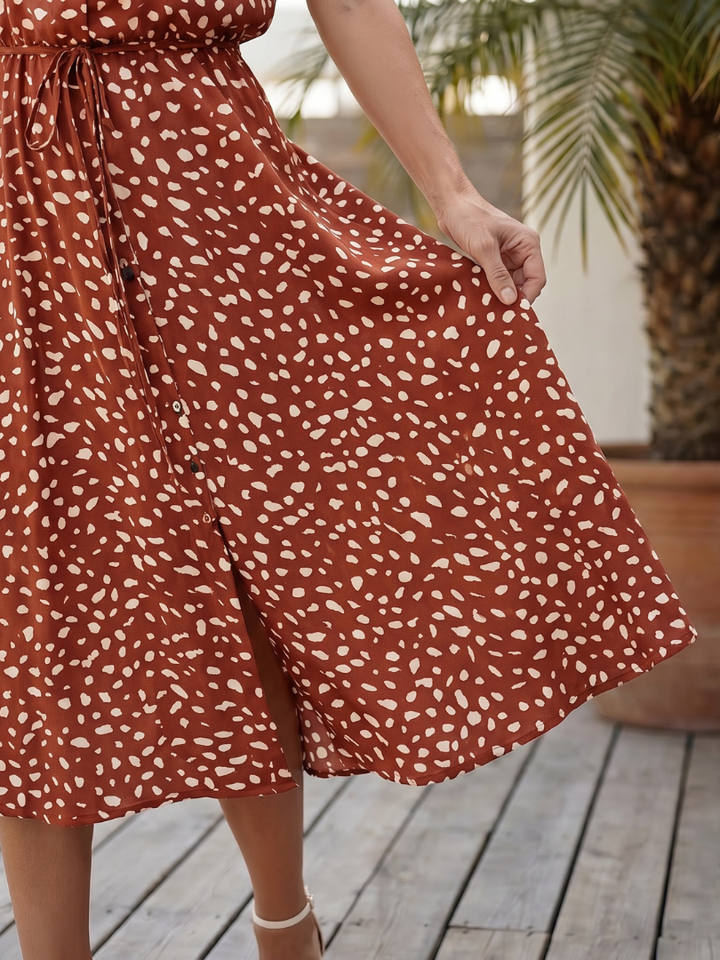 Casual styling of a women's short sleeve printed midi dress, ideal for relaxed everyday wear or summer outings.