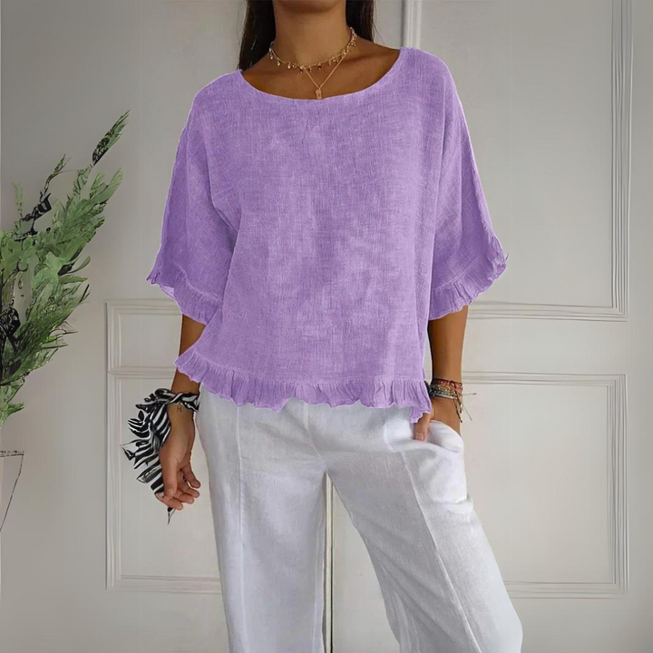 Women's elegant ruffle blouse for everyday wear or special occasions. Stylish, comfortable, and versatile fashion.