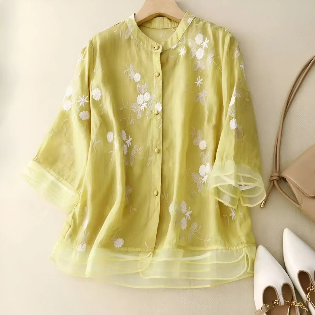 Chic floral embroidered women's top. Tummy skimming, flattering, and elegant for daily wear.