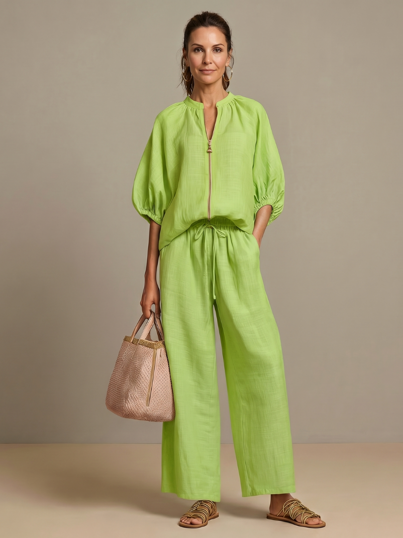 Versatile women's blouse pants set. Zip front blouson top & wide leg pants for a fashion-forward look.