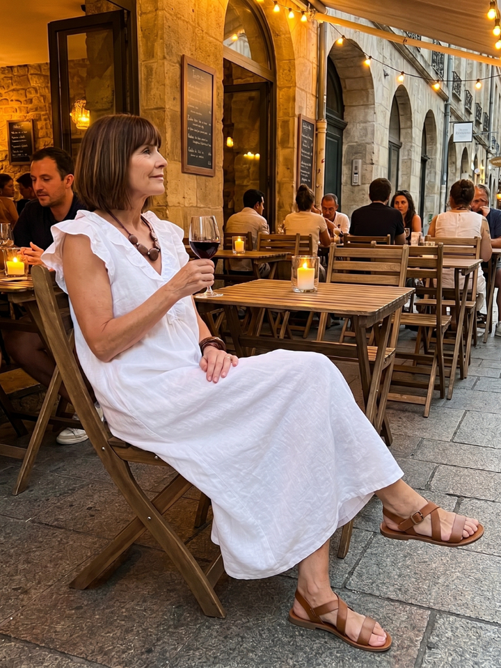 Relaxed fit women's sleeveless midi dress, flowing and comfortable with stylish ruffle trim for warm days.
