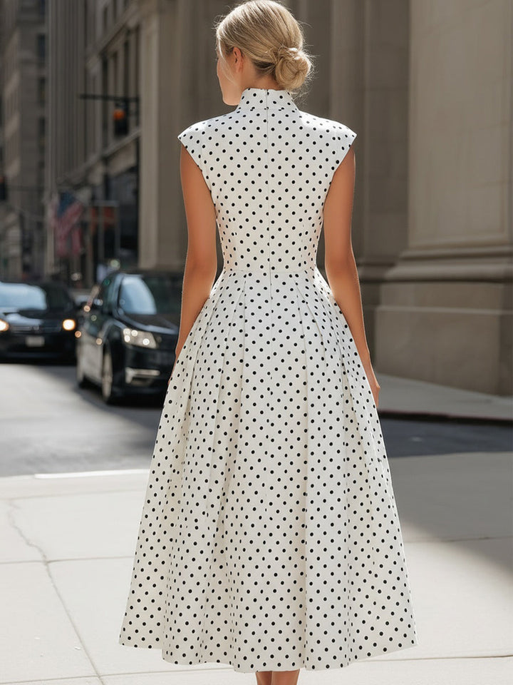 Classic vintage style polka dot A-line midi dress, versatile day dress or elegant cocktail wear.