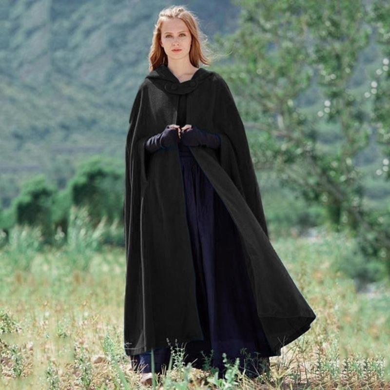 Elegant woman in a flowing blue hooded cloak, featuring a unique mystical design, ideal for fantasy fashion or winter.