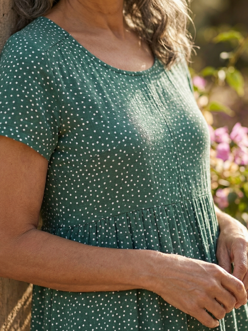 Spring fashion women's relaxed fit dotted dress. Short-sleeve, knee-length, comfortable, and versatile for casual outings.