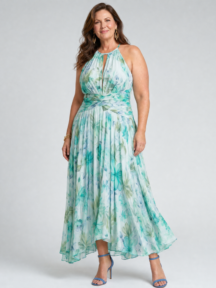 Stylish sleeveless women's green floral midi dress with a comfortable pleated skirt and a fashionable halter design.