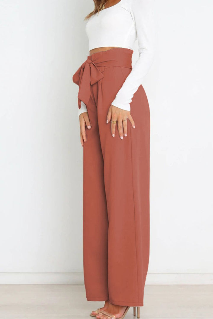 Versatile women's paperbag trousers, high waist, wide leg, elegant bow, for any occasion.
