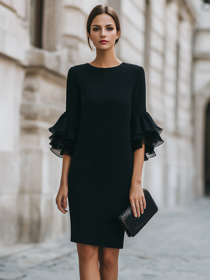 Modest black midi funeral dress for women, showcasing elegant ruffled sheer sleeves and a comfortable, formal knee-length fit.