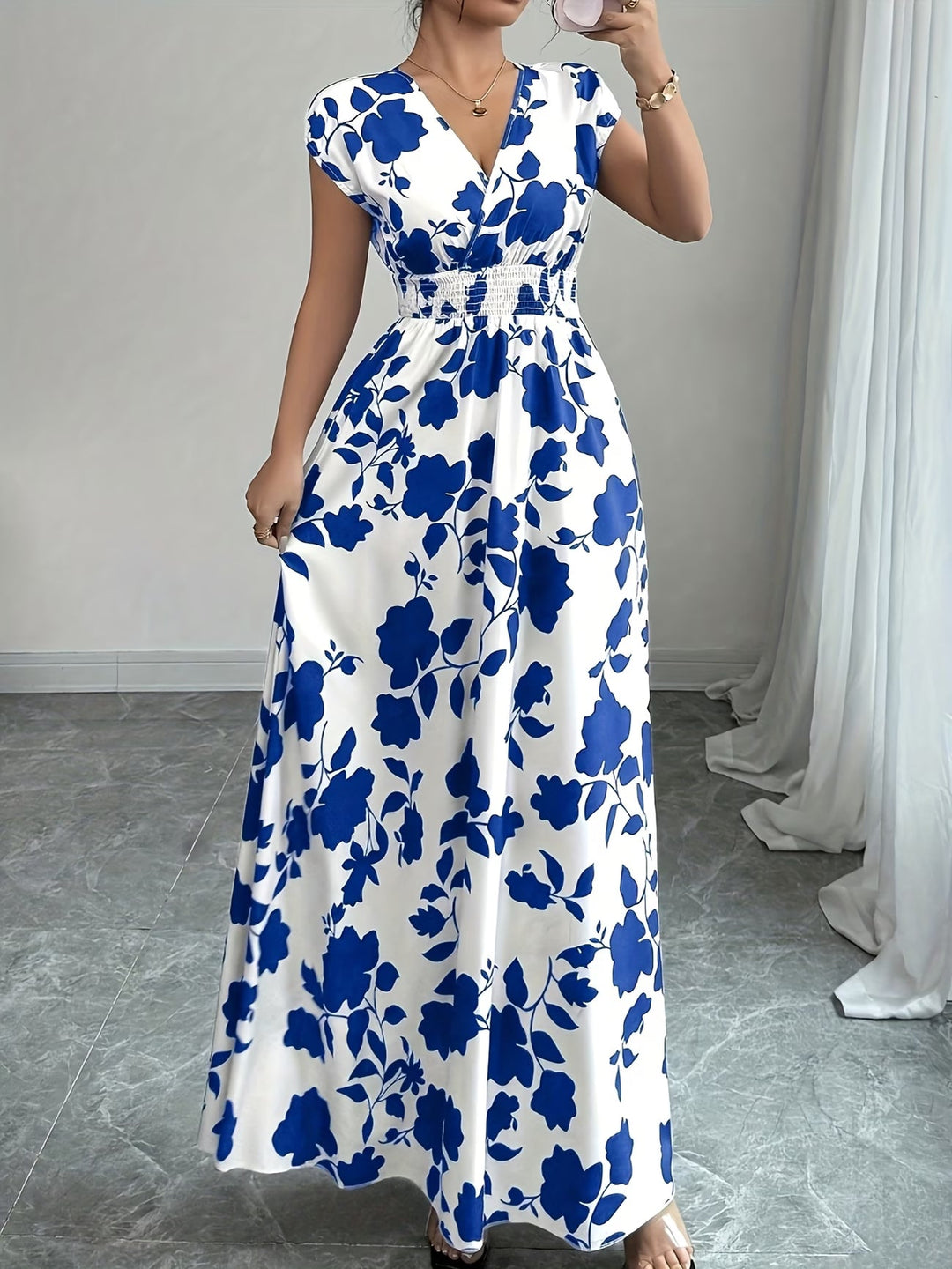 Women's elegant sleeveless V-neck summer dress. A versatile black midi for chic casual looks.