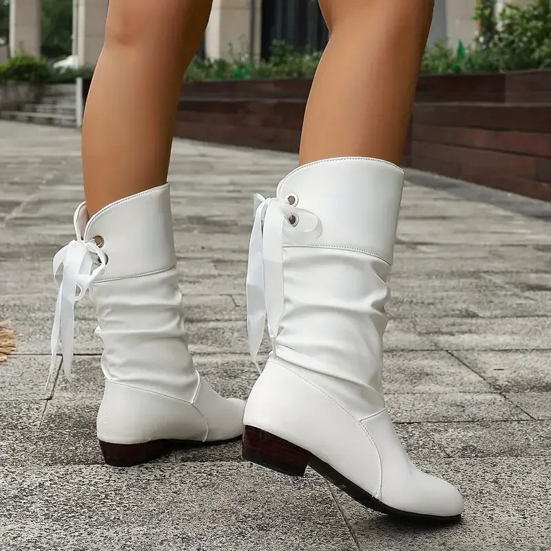 Fashionable women's calf boots featuring a sturdy chunky heel & stylish lacing, great for cold weather.