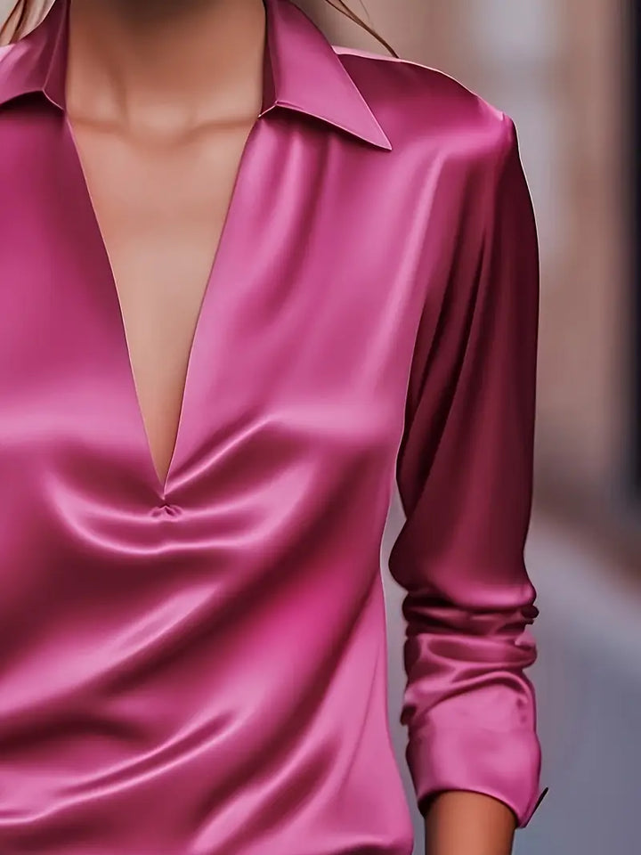 Comfortable women's long sleeve V-neck blouse. Collared design for easy styling, maintaining an elegant look.