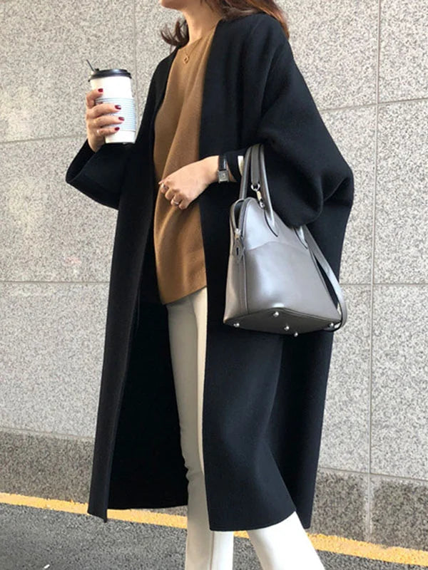 Navy blue elegant long coat for women, designed for ultimate winter warmth & sophisticated fashion.