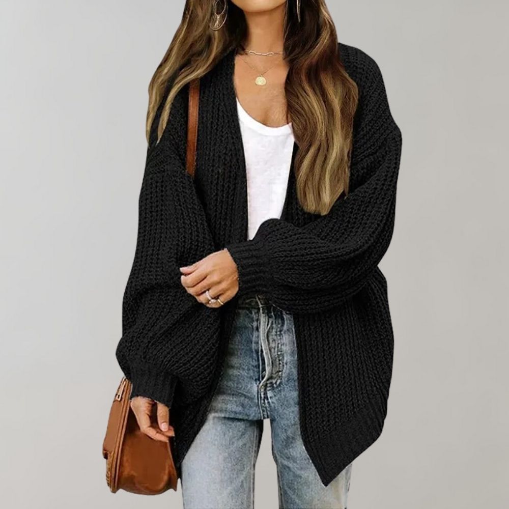 Versatile women's cozy cardigan. Features an open front and elegant bishop sleeves, great for layering.