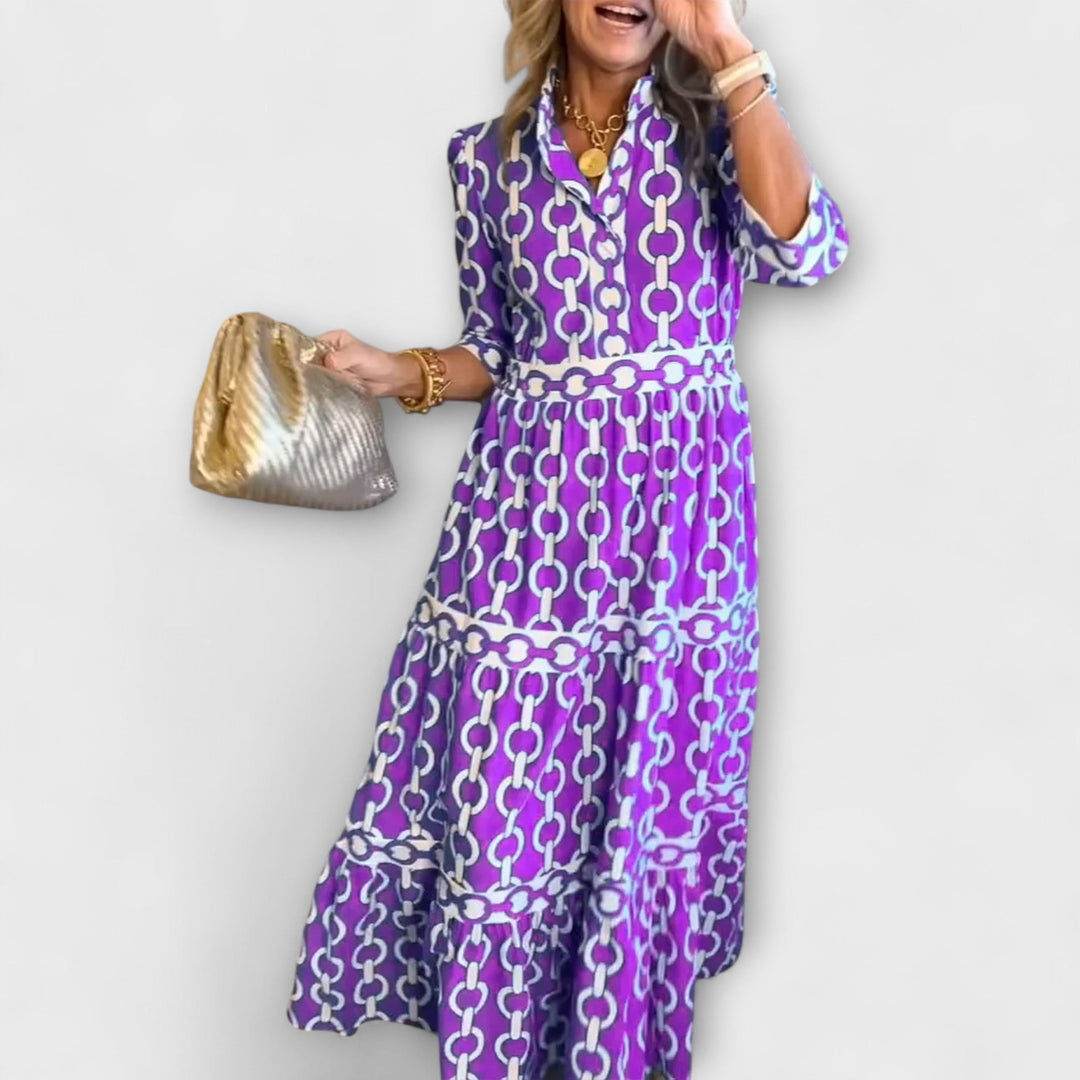 Elegant women's chain print collared midi dress. Versatile statement piece for spring and fall occasions.