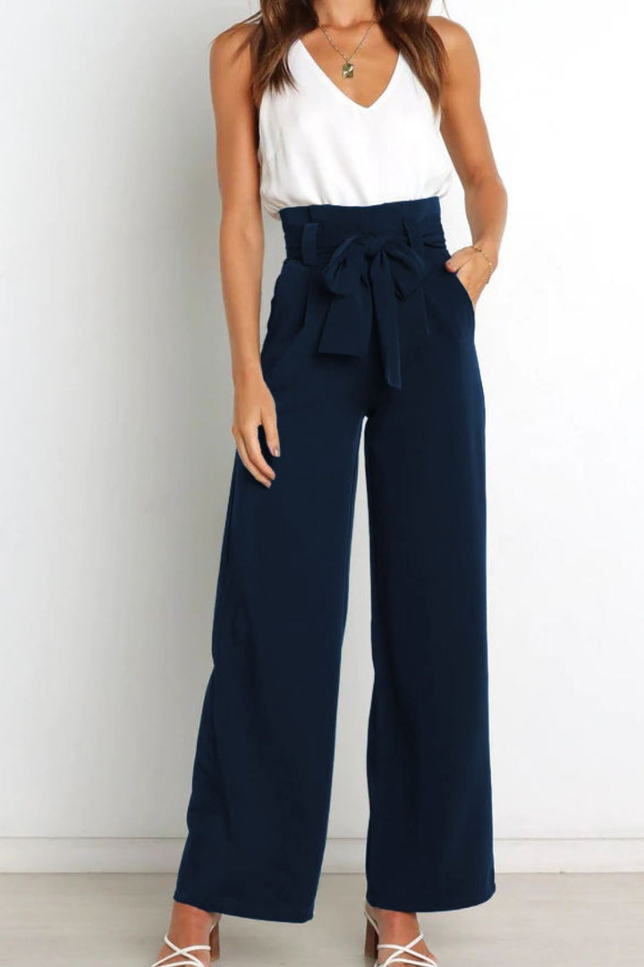 Women's high waist paperbag pants, perfect for spring/summer, with a wide leg & bow.