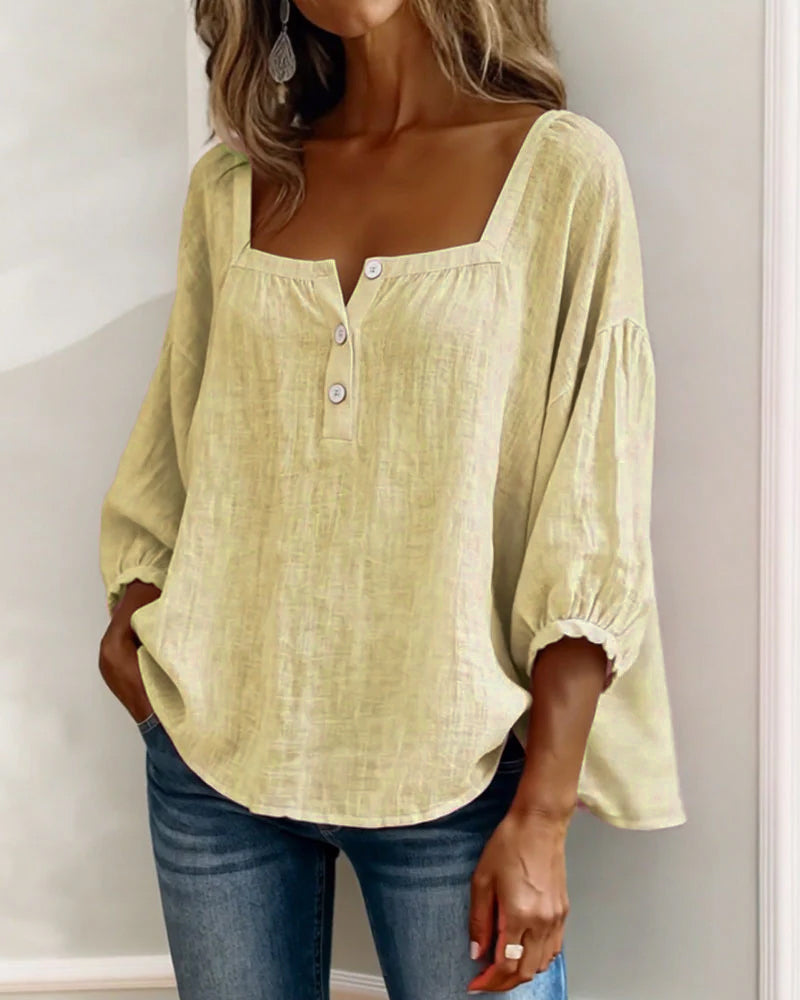 Trendy women's puff sleeve blouse, relaxed fit, perfect for casual elegance.