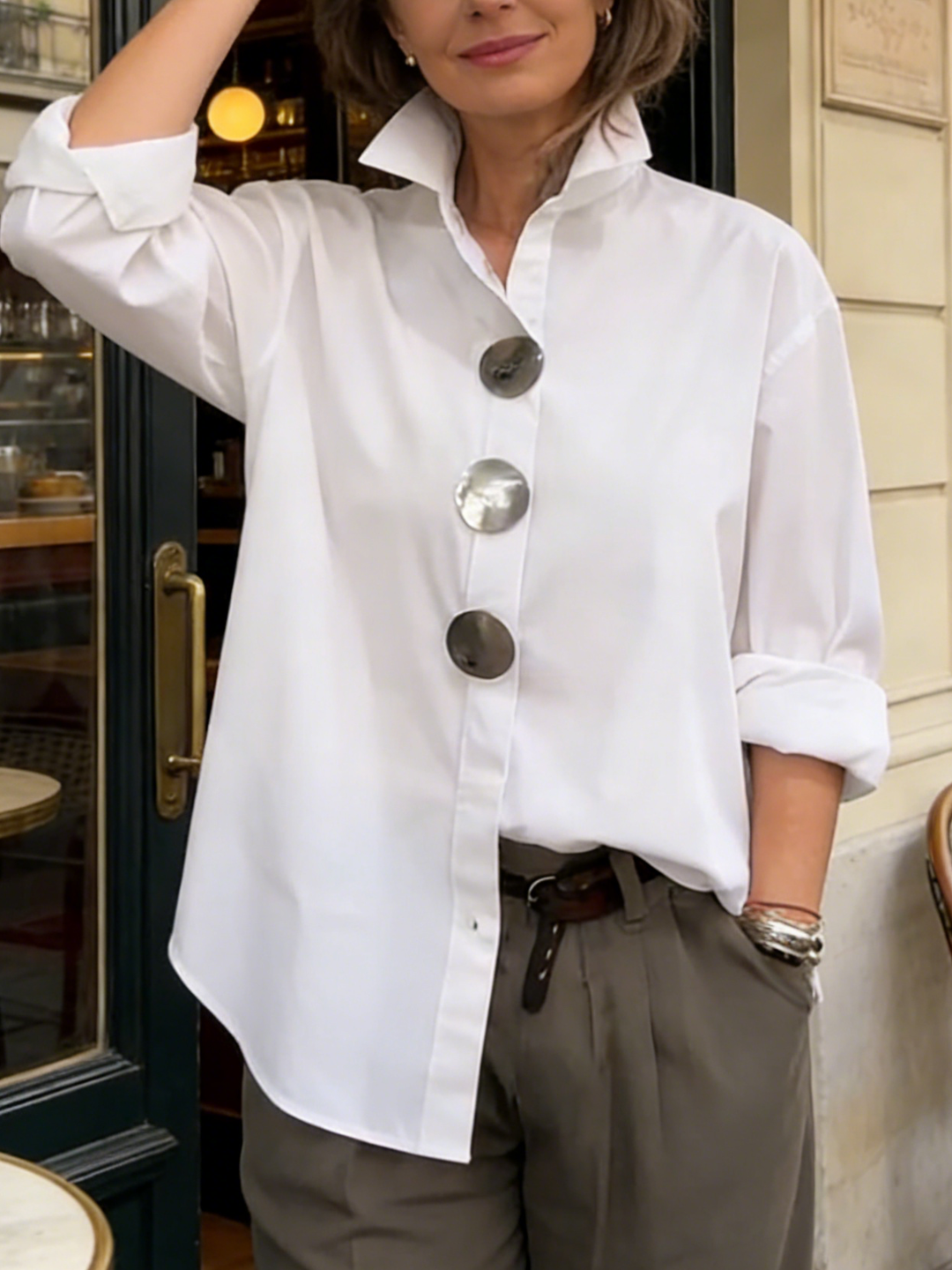 White stylish blouse with big buttons & collar, a versatile women's top for any occasion.
