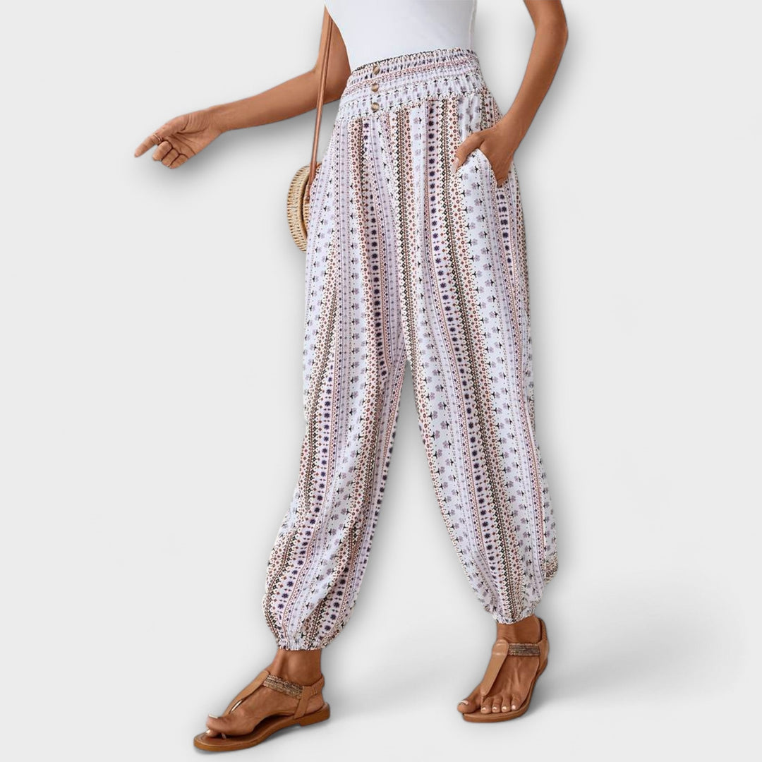 Women's patterned trousers, showcasing an intricate ethnic graphic print and style.