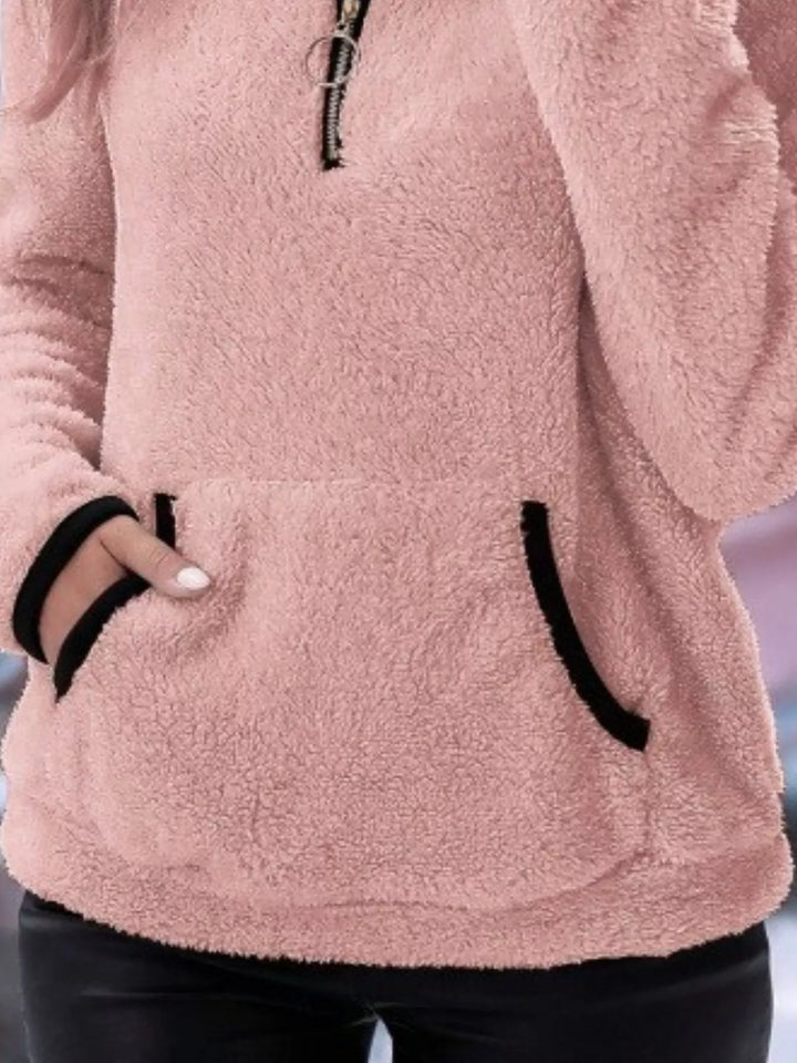 Women's autumn half-zip pullover, combining comfort, style, & layering ease.