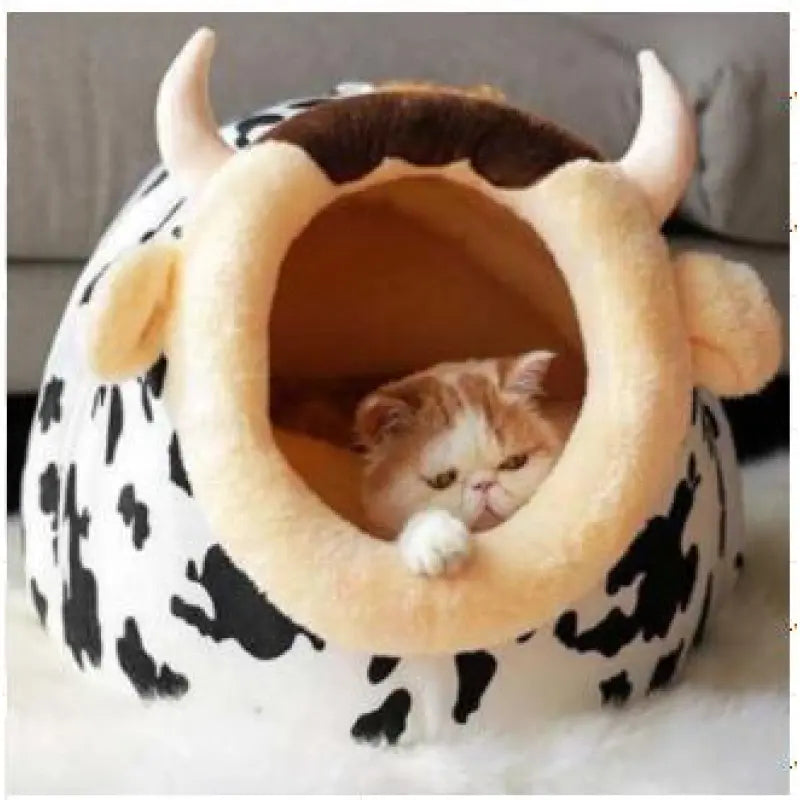 Cozy cat bed with adorable cow design, a soft pet bed for small cats & kittens to nap comfortably.