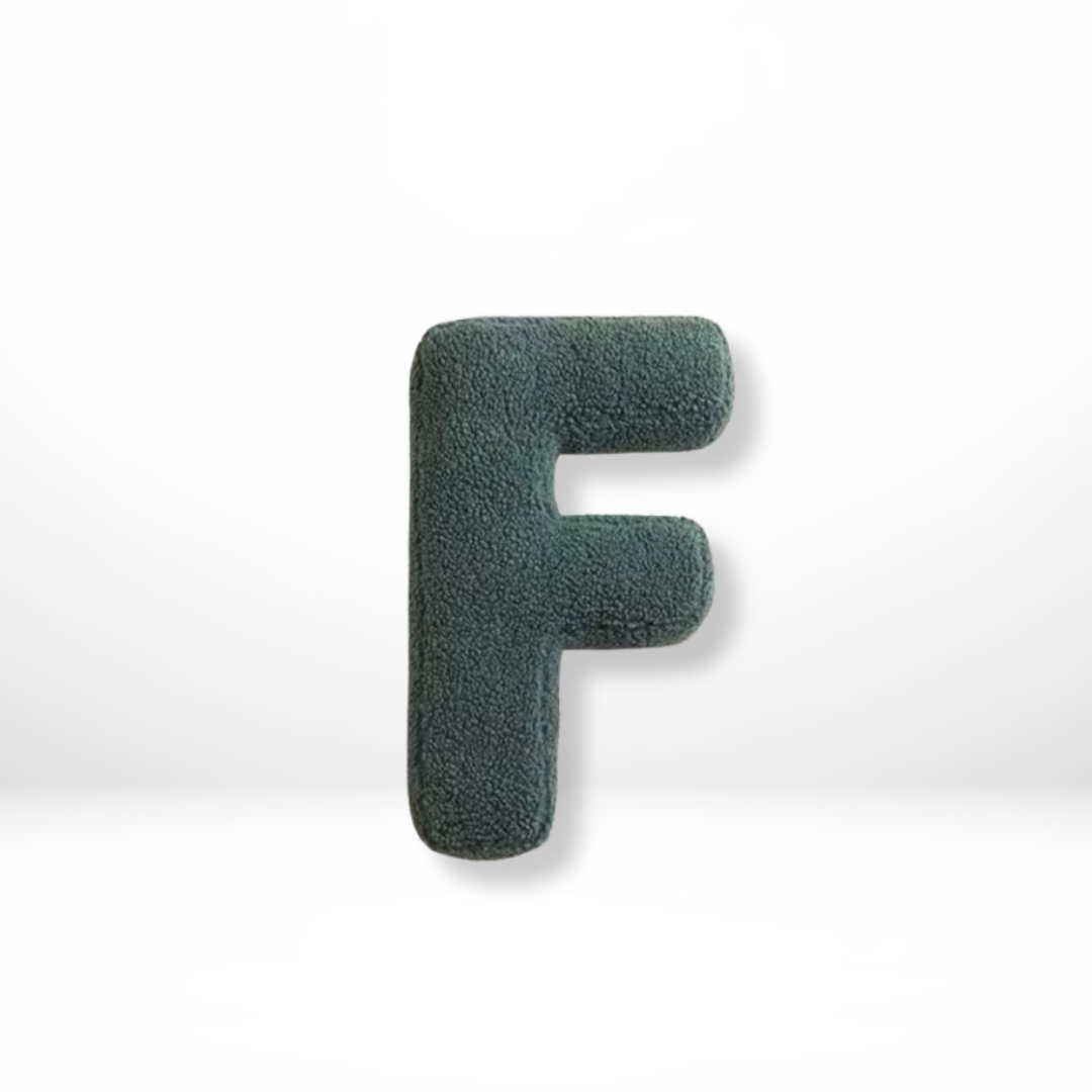 Sophisticated velvet 'J' letter cushion, enhancing home decor with a stylish personalized touch.
