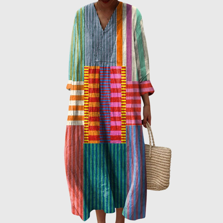 Elegant women's geometric print maxi dress, perfect for versatile day to night styling. Flattering fit.