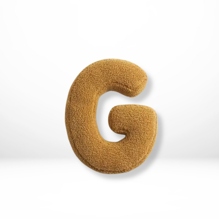 Cozy velvet 'K' alphabet pillow, a soft furnishing for personalized home interior & living room style.