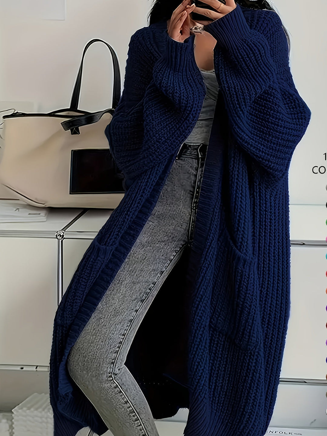 Soft knit V-neck button-front cardigan sweater, showcasing its luxurious, cosy texture.