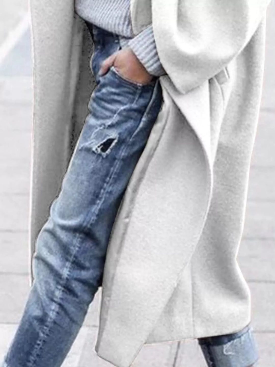 Stylish blue women's long oversized winter coat, perfect for both casual and elegant cold-weather looks.
