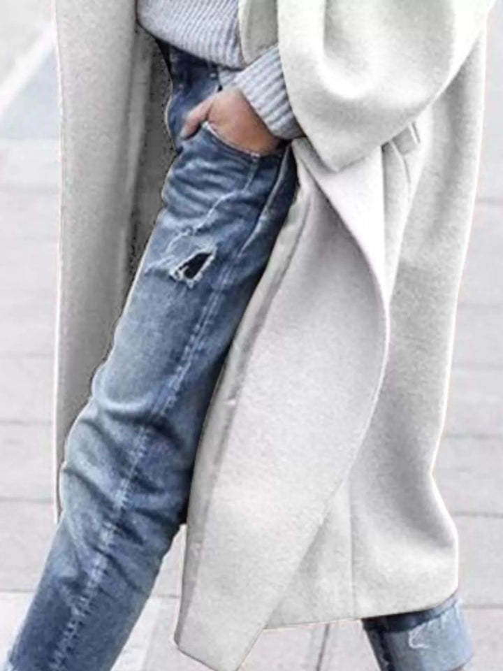 Stylish blue women's long oversized winter coat, perfect for both casual and elegant cold-weather looks.